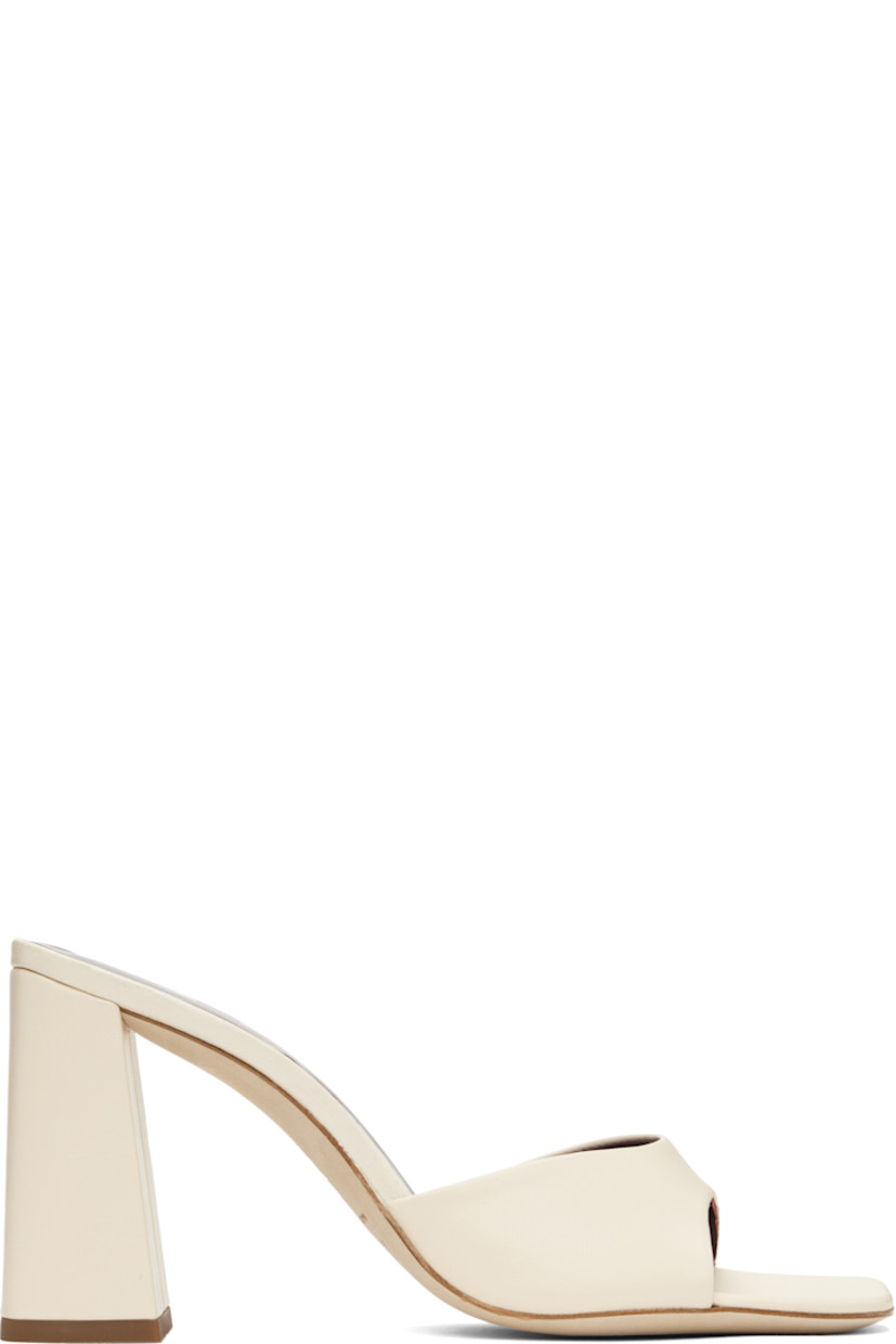 Buffed leather heeled sandals in off-white.

· Open square toe
· Logo embossed at padded footbed
· Covered block heel with rubber injection
· Leather sole
· Heel: H3.25"

Supplier color: Cream