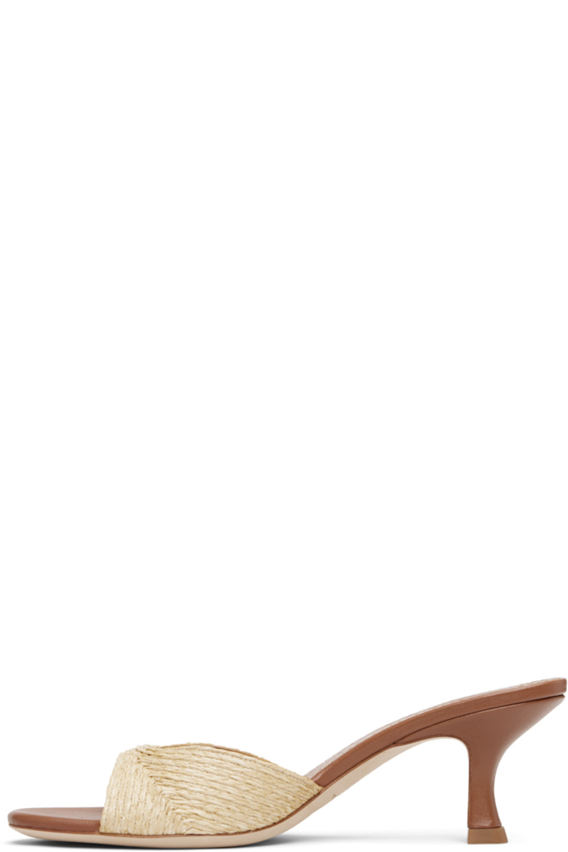 Buffed leather and woven raffia heeled mules.

· Open toe
· Logo embossed at padded leather footbed
· Leather-covered kitten heel with rubber injection.
· Nubuck sole
· Heel: H2"

Supplier color: Natural Raffia
