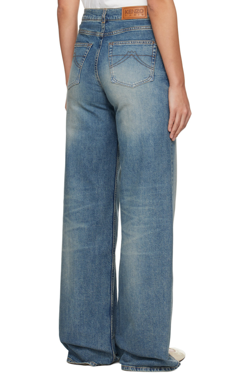 Stretch denim jeans. Fading and whiskering throughout.

· Belt loops
· Five-pocket styling 
· Zip-fly 
· Leather logo patch at back waistband
· Logo-engraved silver-tone hardware
· Contrast stitching in tan

Supplier color: Medium stone blue