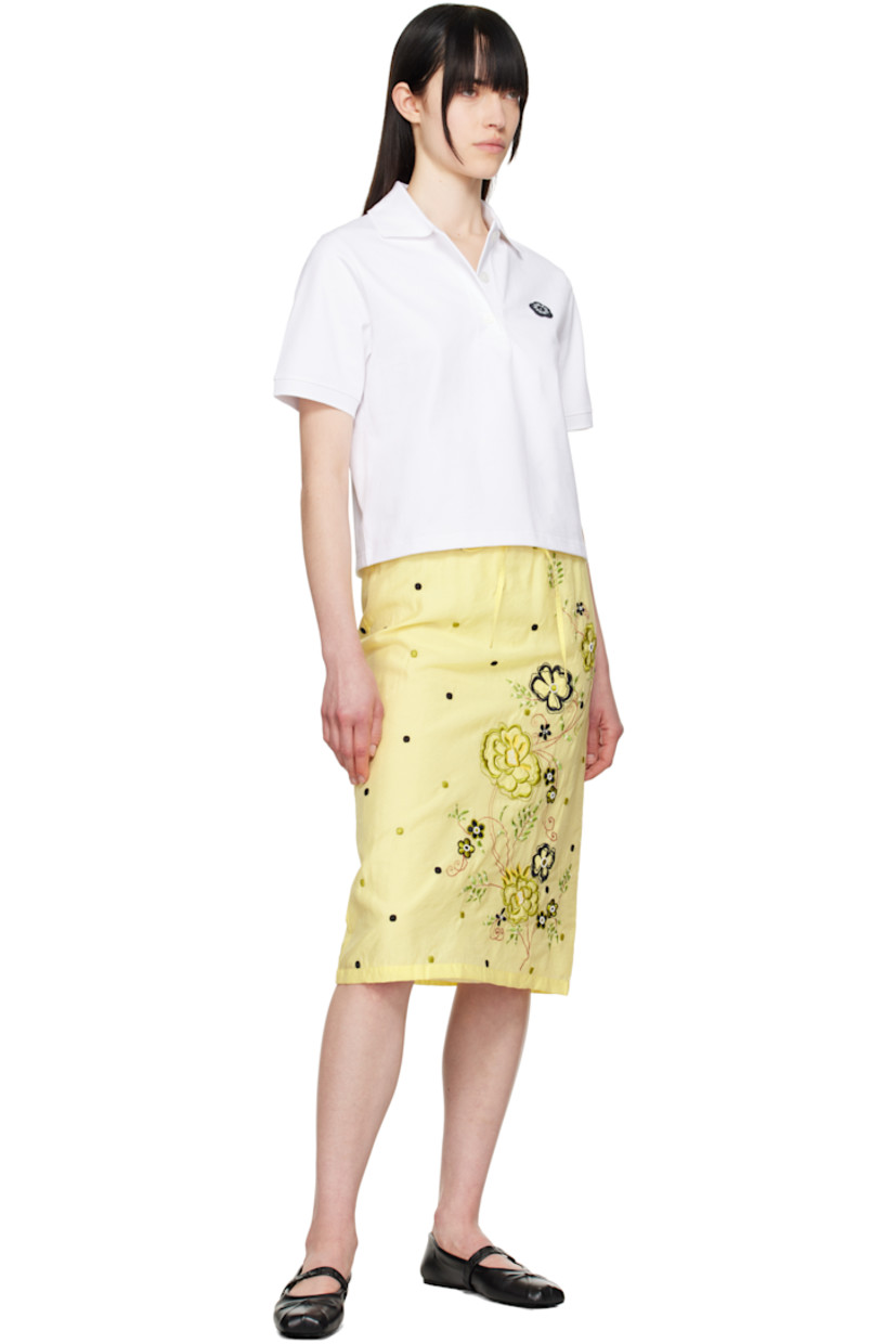 Viscose- and cotton-blend organza midi skirt. Polka-dot pattern embroidered throughout. 

· Drawstring at elasticized waistband
· Embroidered and beaded floral graphic at front
· Full viscose twill lining

Supplier color: Vanilla