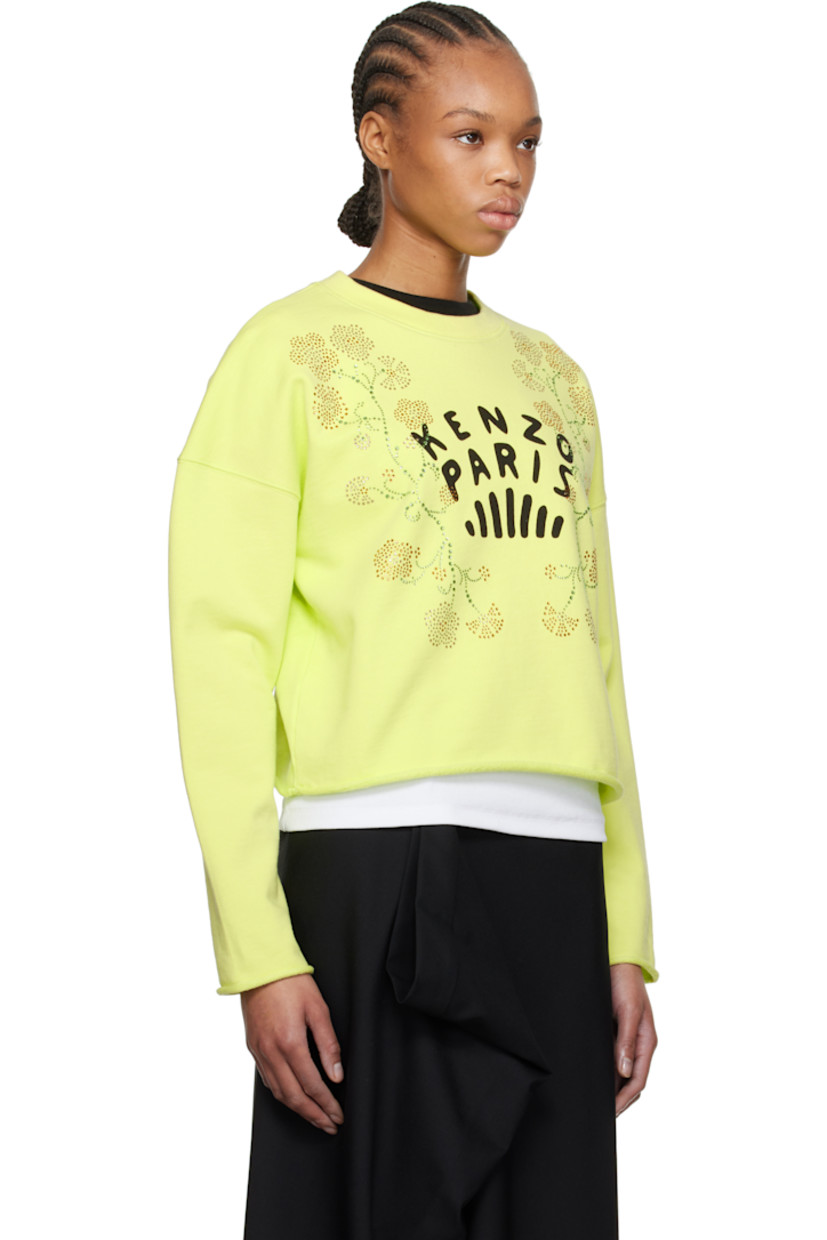 French terry sweatshirt. 

· Rib-knit crewneck
· Crystal-cut floral graphics and printed logo at front 
· Rolled raw edge at hem and cuffs
· Dropped shoulders

Supplier color: Lemon