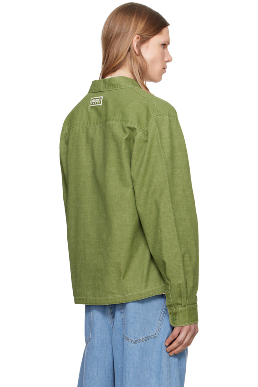 Cotton hopsack overshirt. 

· Spread collar
· Button closure 
· Bellows pockets at chest and sleeve
· Concealed drawstring at hem
· Pleated single-button barrel cuffs
· Embroidered logo patch at back collar

Supplier color: Pale khaki