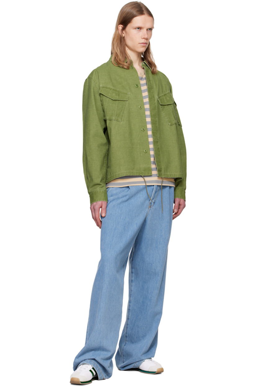 Cotton hopsack overshirt. 

· Spread collar
· Button closure 
· Bellows pockets at chest and sleeve
· Concealed drawstring at hem
· Pleated single-button barrel cuffs
· Embroidered logo patch at back collar

Supplier color: Pale khaki