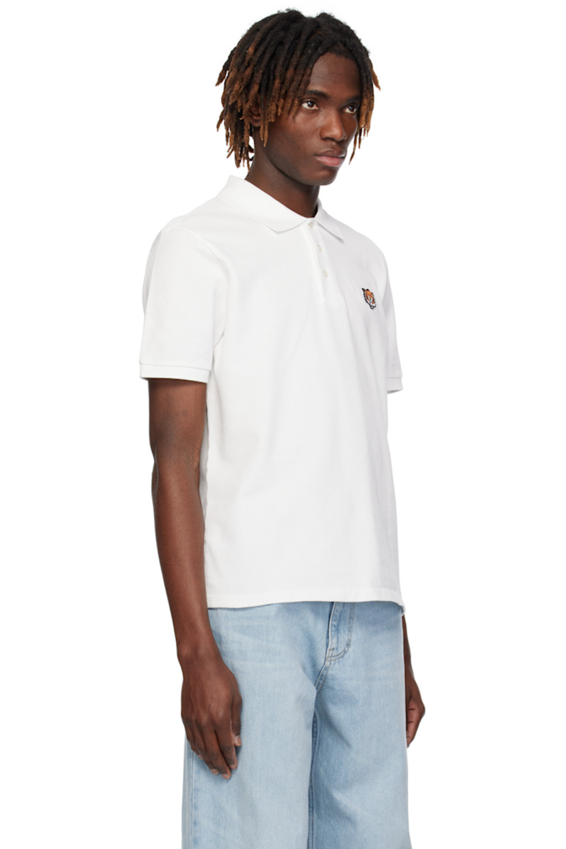Slim-fit GOTS-certified organic cotton piqué polo. 

· Rib-knit spread collar and cuffs
· Three-button placket
· Embroidered logo graphic patch at chest
· Logo embroidered at back collar 

Supplier color: Off white