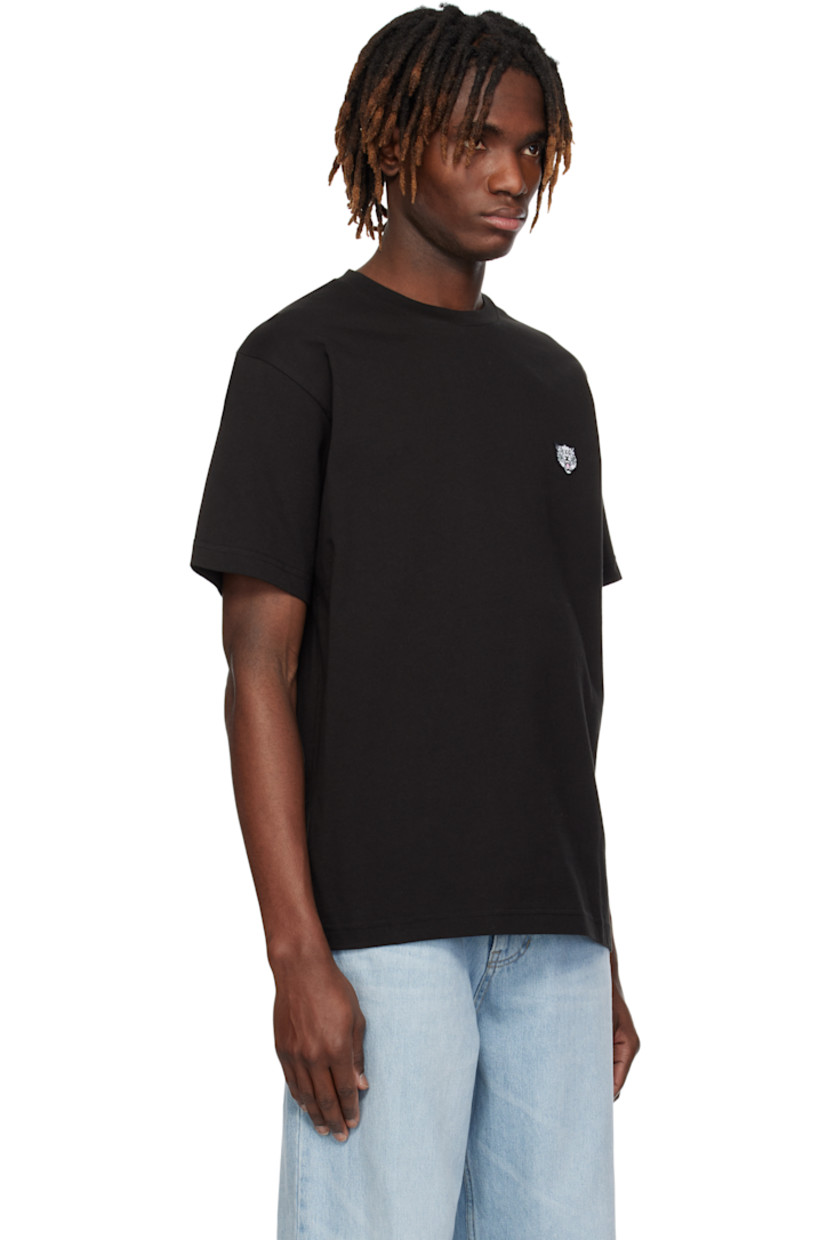 GOTS-certified organic cotton jersey T-shirt. 

· Rib-knit crewneck
· Embroidered logo graphic patch at chest
· Logo embroidered at back collar

Supplier color: Black