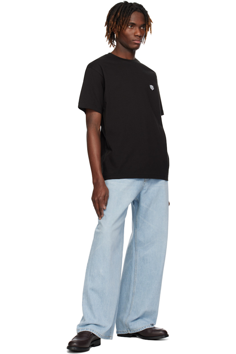 GOTS-certified organic cotton jersey T-shirt. 

· Rib-knit crewneck
· Embroidered logo graphic patch at chest
· Logo embroidered at back collar

Supplier color: Black