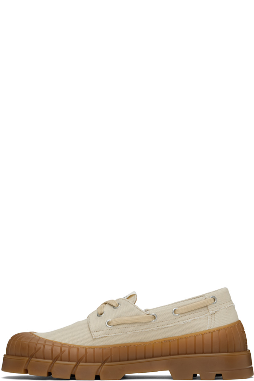 Cotton canvas boat shoes in beige.

· Rubber cap toe
· Lace-up closure
· Logo patch at tongue
· Logo hardware at outer side
· Logo embossed at heel counter
· Buffed leather and suede lining
· Textured rubber midsole
· Treaded rubber sole

Supplier color: Beige