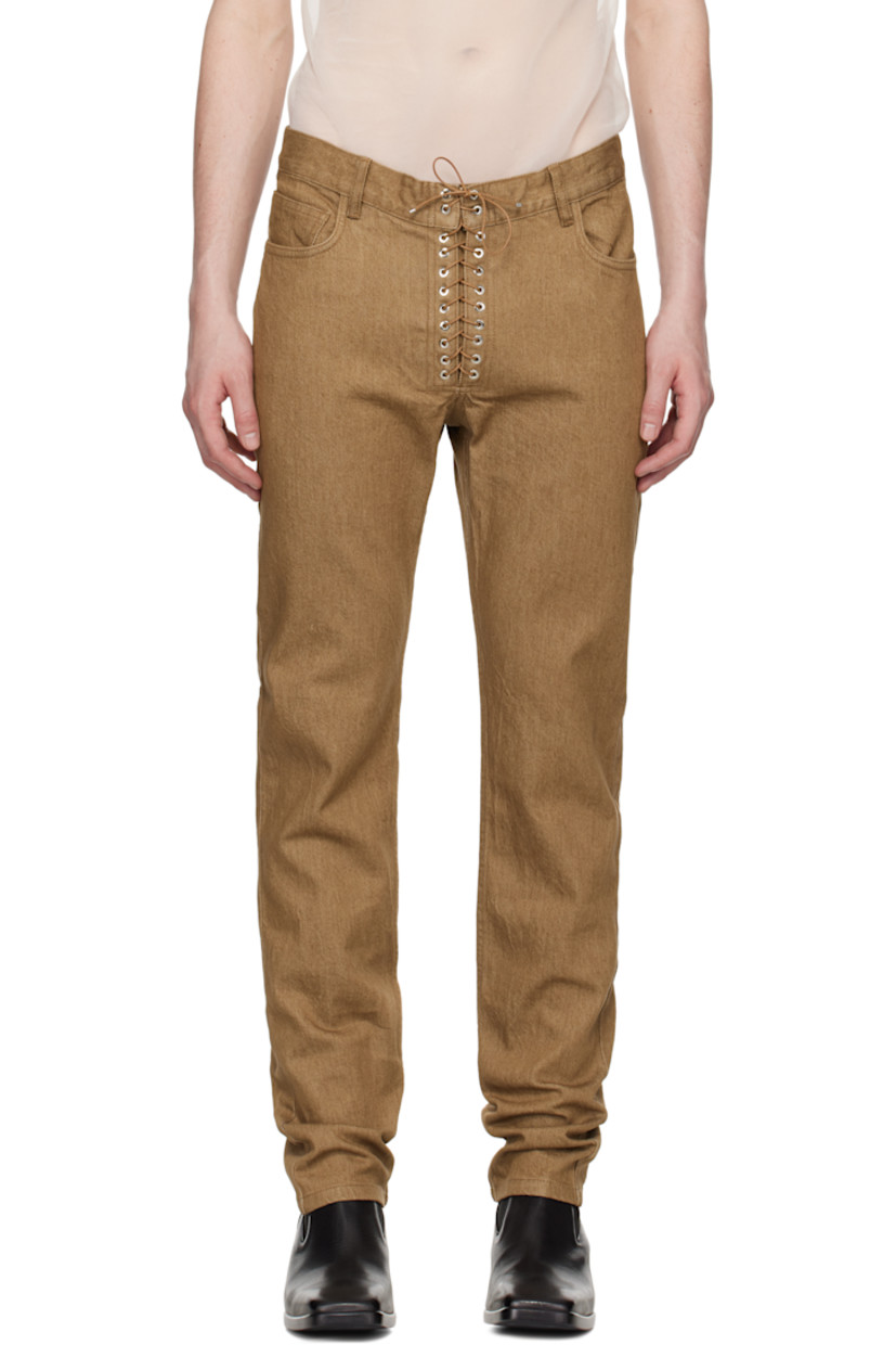 Stretch denim jeans. 

·� Loose-fit and straight-leg 
· Belt loops
· Five-pocket styling
· Exposed lace-up fly
· Logo patch at back waistband
· Grommets at back pockets

Supplier color: Brown