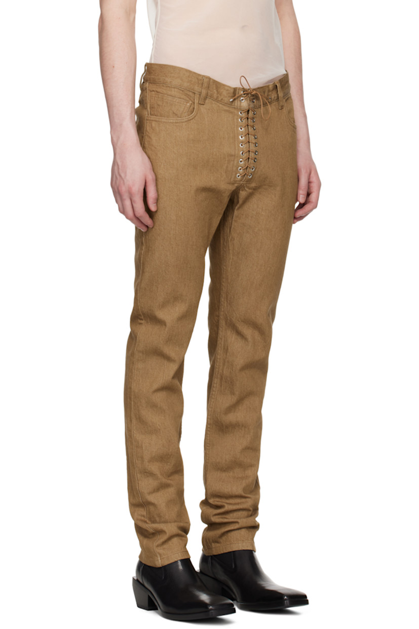 Stretch denim jeans. 

· Loose-fit and straight-leg 
· Belt loops
· Five-pocket styling
· Exposed lace-up fly
· Logo patch at back waistband
· Grommets at back pockets

Supplier color: Brown
