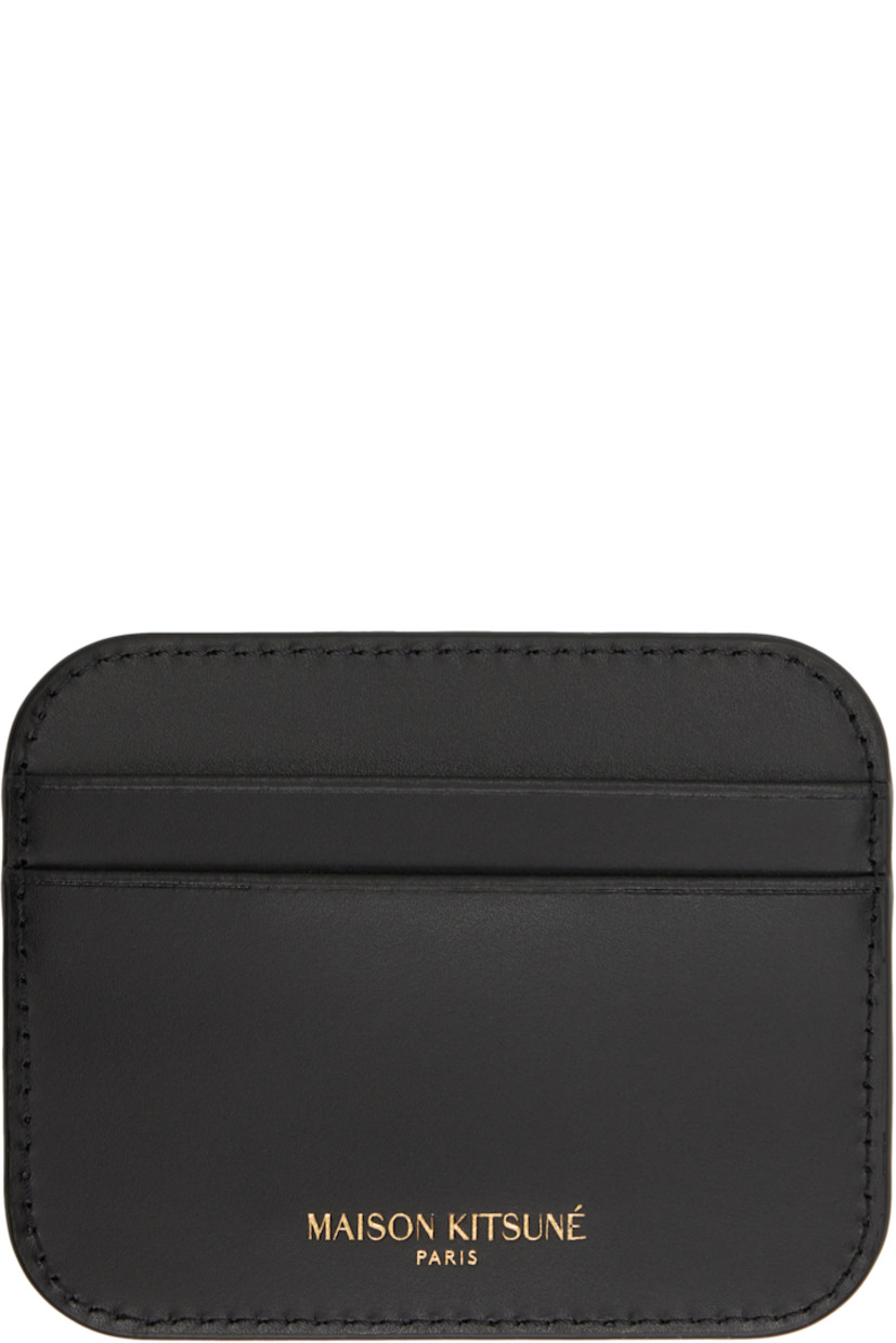 Buffed calfskin card holder in black.

· Logo hardware at face
· Logo stamp at back face 
· Four card slots
· Satin lining
· Gold-tone hardware
· H3" x W3.75"

Supplier color: Black