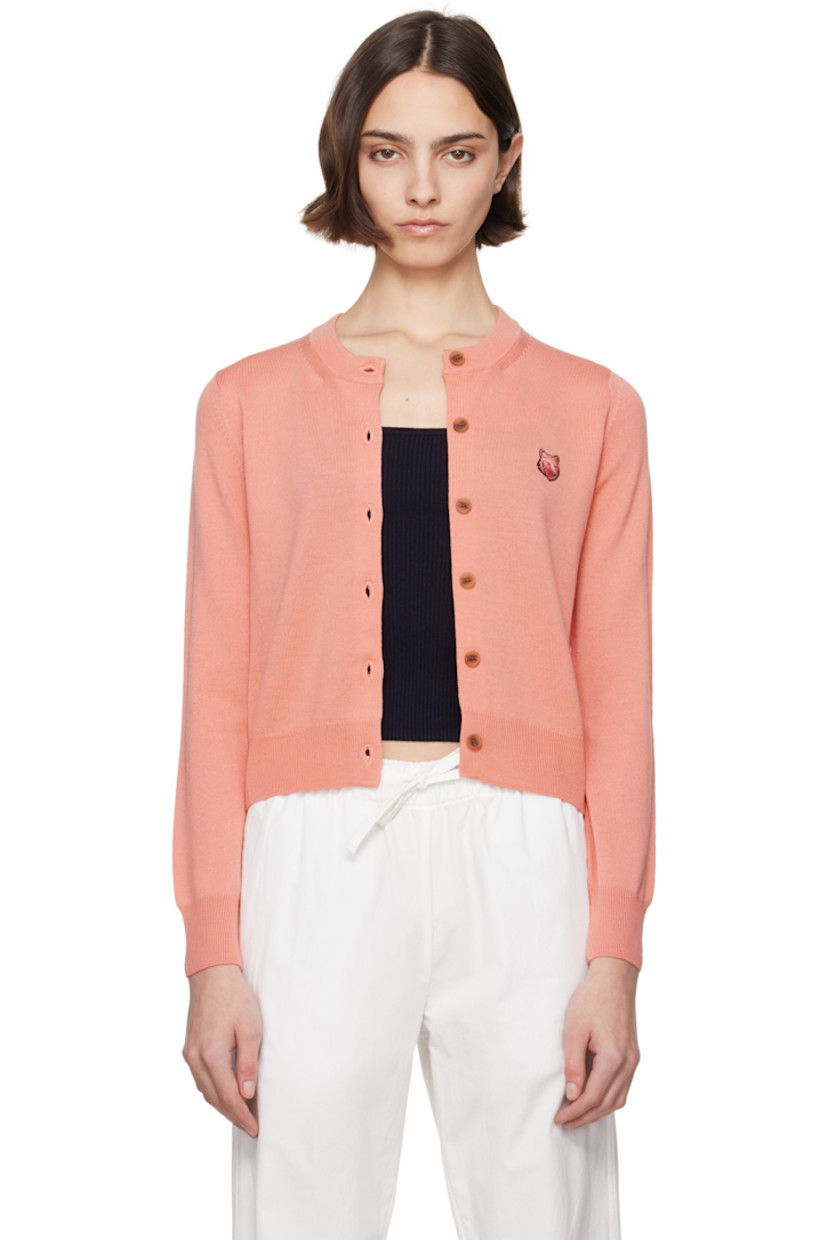 Knit wool cardigan.

· Rib-knit crewneck, hem, and cuffs
· Button closure
· Embroidered logo patch at chest

Supplier color: Gerbera red