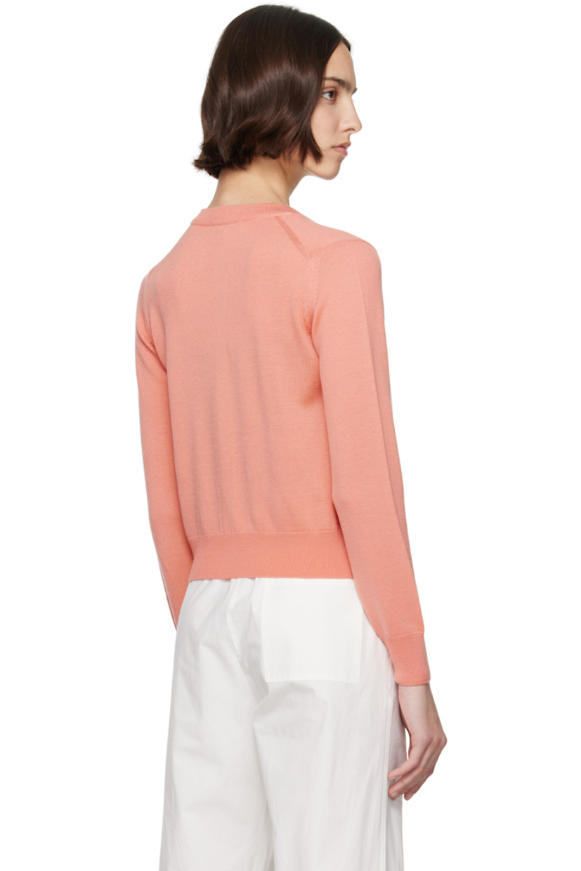 Knit wool cardigan.

· Rib-knit crewneck, hem, and cuffs
· Button closure
· Embroidered logo patch at chest

Supplier color: Gerbera red