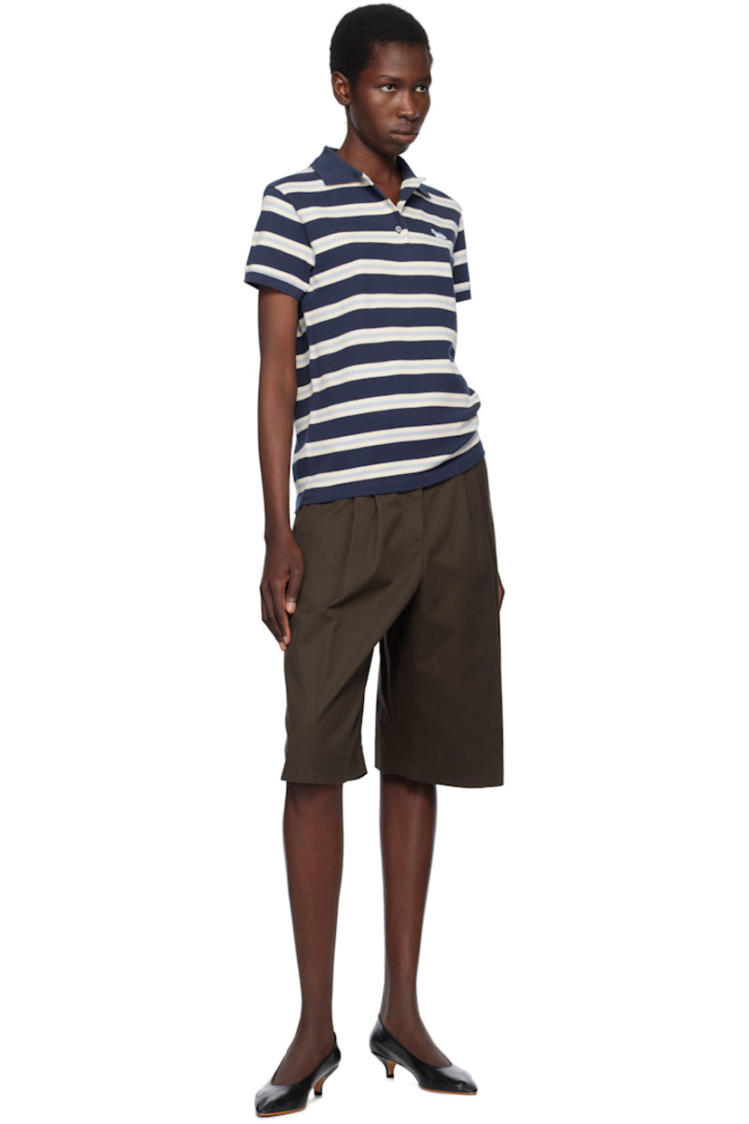 Cotton piqué polo. Jacquard stripes throughout.

· Rib-knit spread collar and cuffs
· Three-button placket
· Embroidered logo patch at chest
· Logo-engraved black hardware

Supplier color: Ink blue/Hortensia/Marble