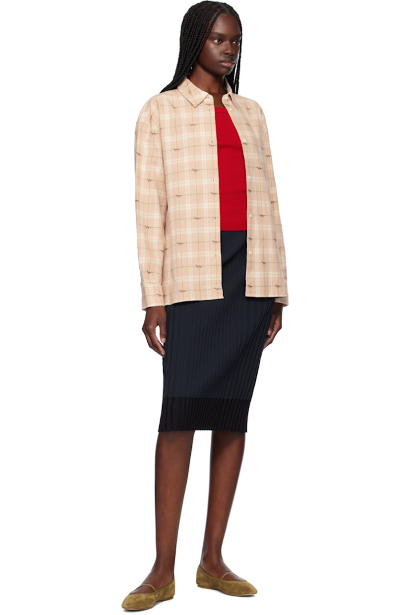 Cotton flannel overshirt. Check pattern and jacquard logo pattern throughout. 

· Spread collar
· Button closure
· Shirttail hem
· Dropped shoulders
· Buttoned barrel cuffs
· Box pleat at back yoke

Supplier color: Milk/pink check