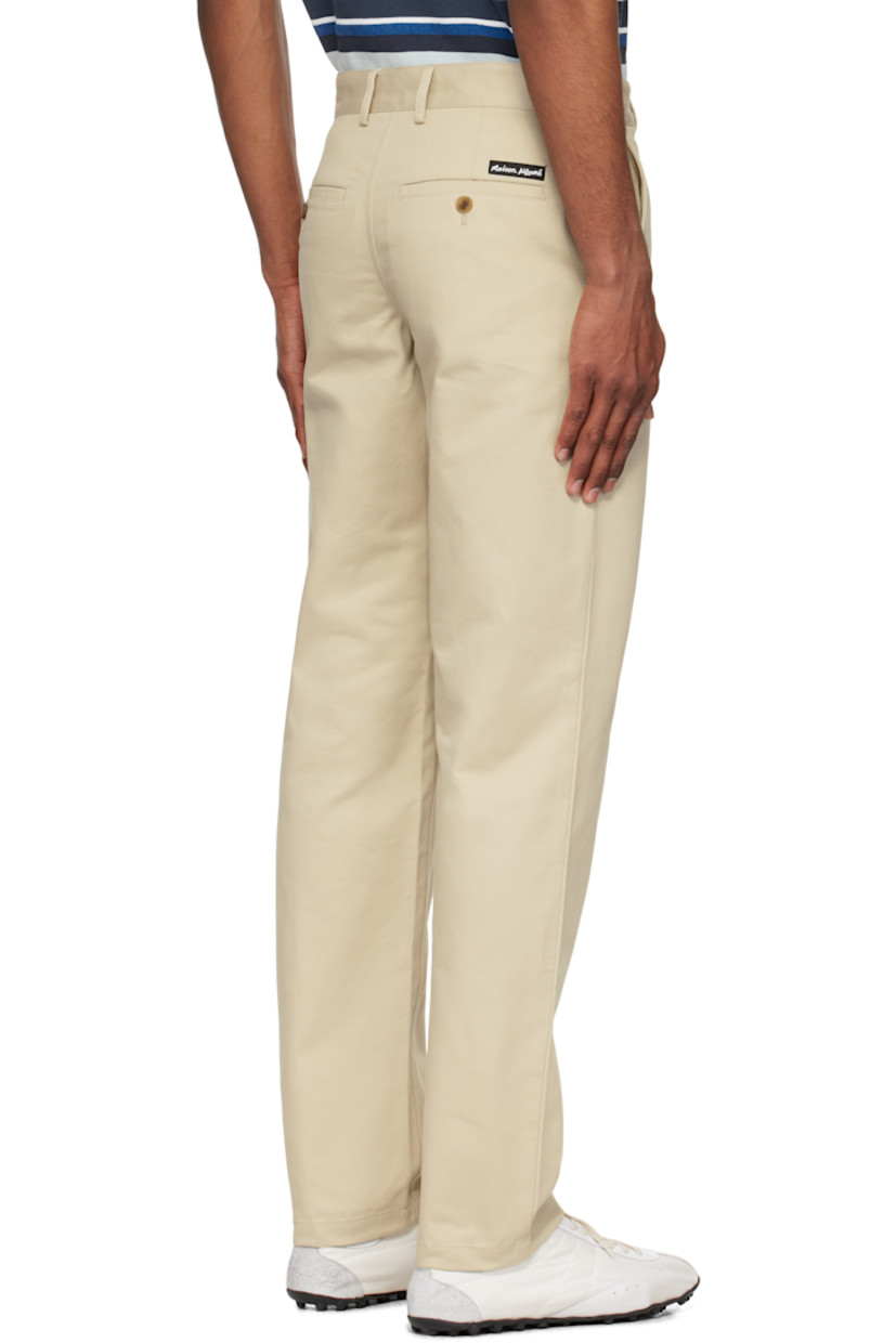 Straight-leg cotton gabardine trousers. 

· Belt loops
· Four-pocket styling
· Zip fly
· Logo patch at back waist

Supplier color: Dune