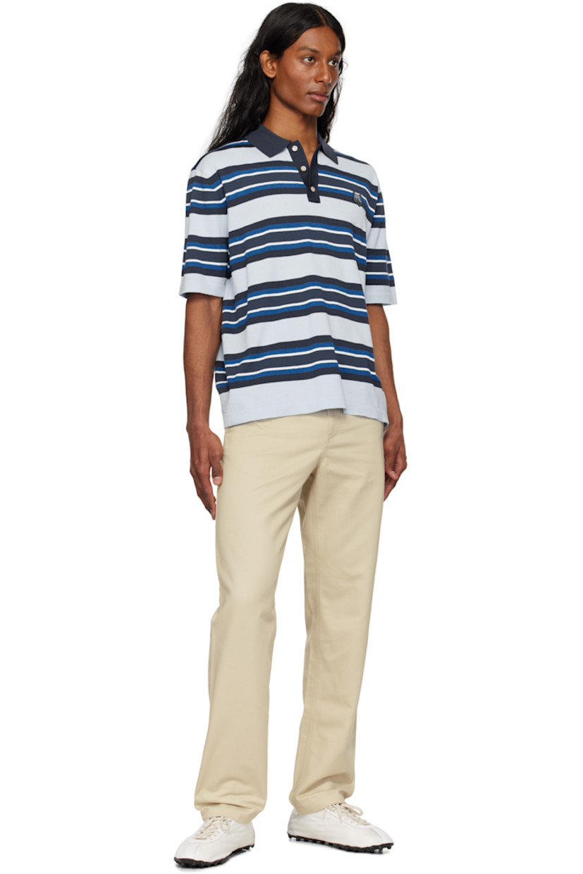 Straight-leg cotton gabardine trousers. 

· Belt loops
· Four-pocket styling
· Zip fly
· Logo patch at back waist

Supplier color: Dune