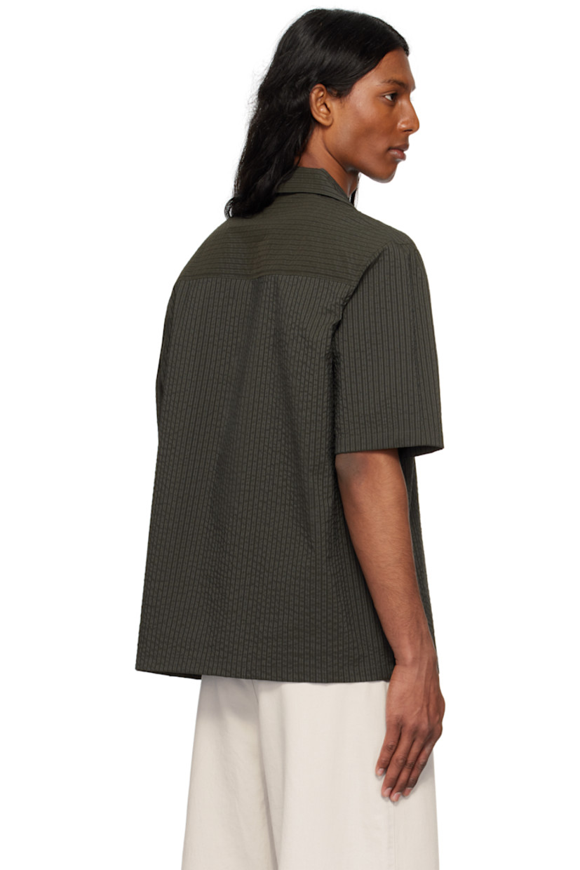 Boxy-fit polyester- and cotton-blend seersucker shirt. Stripes throughout.

· Open spread collar
· Button closure
· Logo patch at patch pocket 

Supplier color: Ranger green