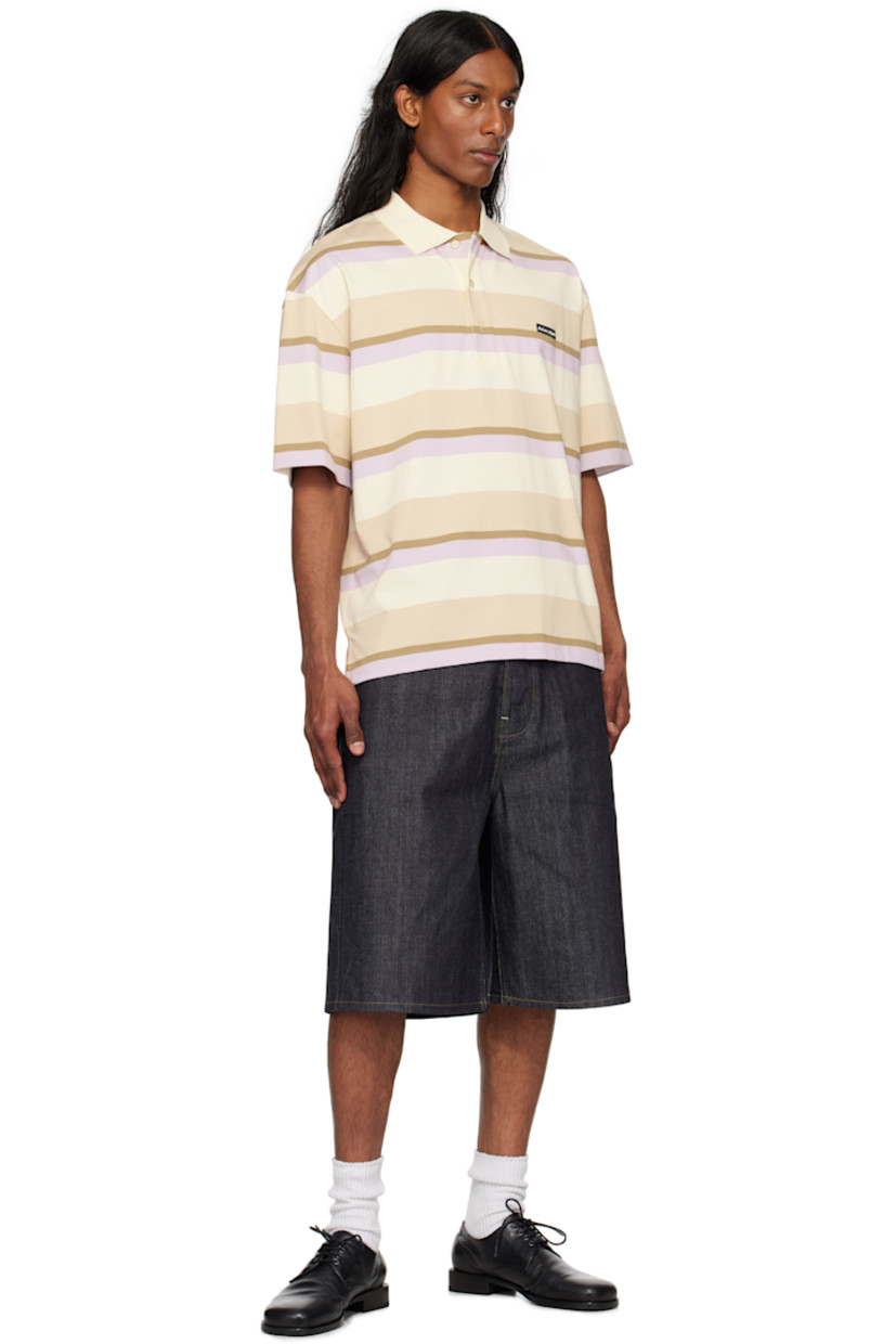 Oversized cotton jersey polo. Jacquard stripes throughout.

· Rib-knit spread collar
· Three-button placket
· Logo patch at chest
· Tennis-tail hem
· Dropped shoulders

Supplier color: Soft mauve/Cardamone