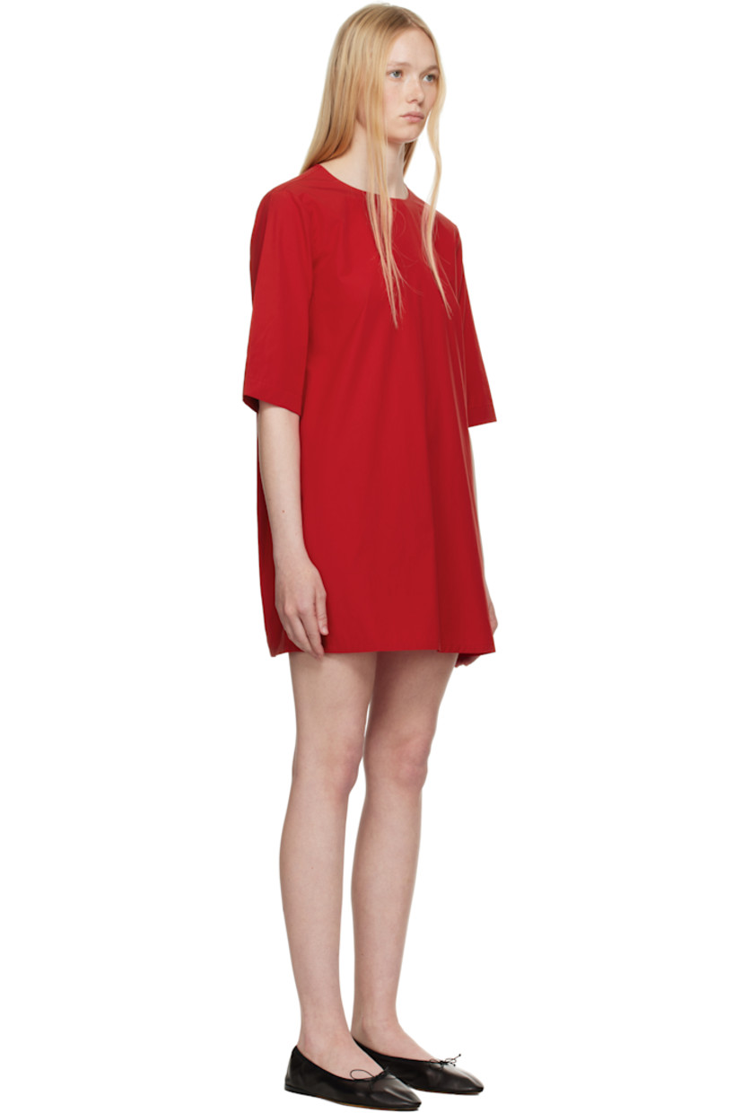 Organic cotton poplin minidress. 

· Round neck
· Seam pockets
· Dropped shoulders
· Self-tie keyhole with extended silk drawstring at back
· Twin pleats at back yoke
· Unlined

Supplier color: Red apple