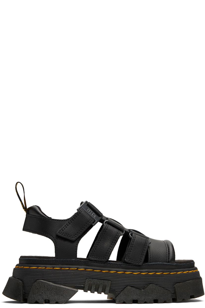 Coated grained leather flat sandals in black.

· Cutouts throughout
· Open square toe
· Velcro straps at vamp
· Logo-woven pull-loop at padded heel tab
· Logo-printed padded suede footbed
· Yellow topstitching at heat-sealed Goodyear welt
· Foam rubber platform midsole and heel
· Treaded Air Cushion rubber sole
· Platform: H1.75"
· Heel: H2"

Supplier color: Black