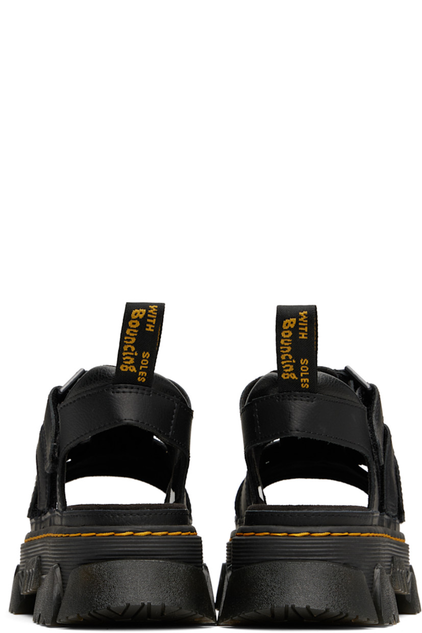 Coated grained leather flat sandals in black.

· Cutouts throughout
· Open square toe
· Velcro straps at vamp
· Logo-woven pull-loop at padded heel tab
· Logo-printed padded suede footbed
· Yellow topstitching at heat-sealed Goodyear welt
· Foam rubber platform midsole and heel
· Treaded Air Cushion rubber sole
· Platform: H1.75"
· Heel: H2"

Supplier color: Black