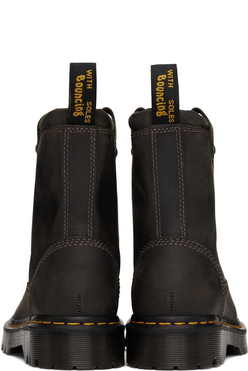 Ankle-high waxed buffed leather boots in gray.

· Fading throughout
· Pull-loops at collar
· Logo-engraved rivets at sides
· Yellow topstitching at heat-sealed Goodyear welt
· Treaded Air Cushion rubber sole

Supplier color: Charcoal grey