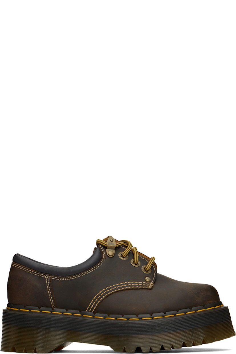 Oiled leather derbys in brown.

· Fading throughout
· Lace-up closure
· Padded collar
· Yellow topstitching at heat-sealed Goodyear welt
· Treaded Air Cushion rubber platform sole
· Platform: H2"

Supplier color: Dark brown crazy horse
