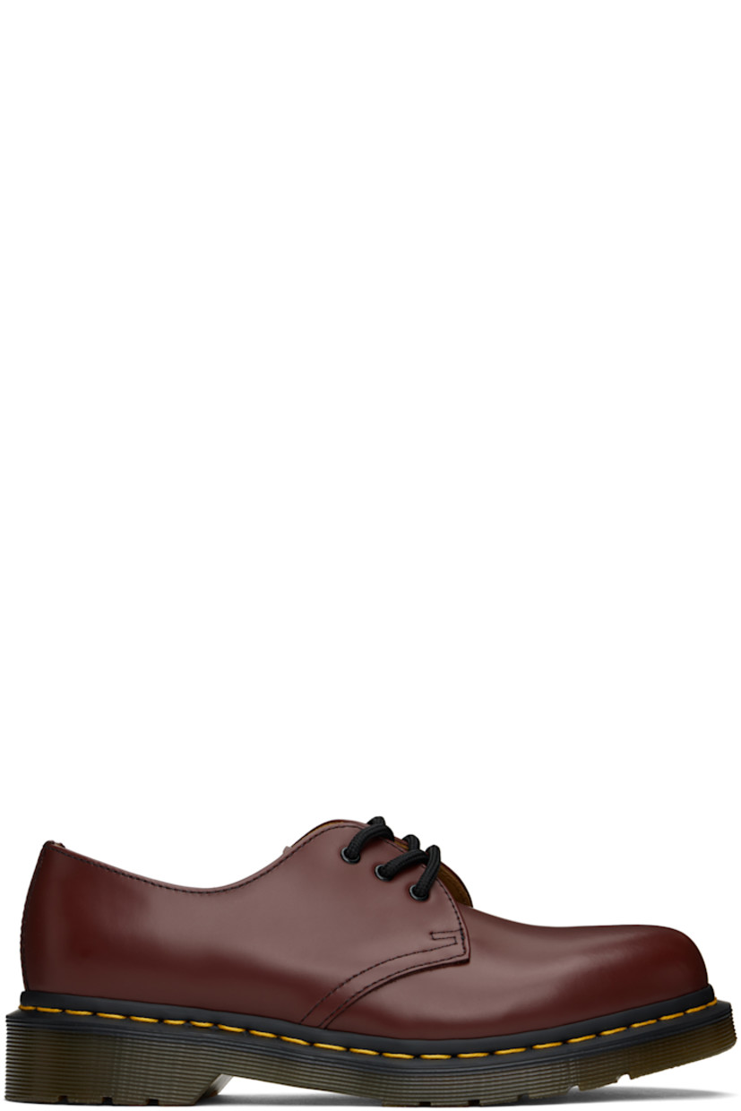 Polished leather derbys in burgundy.

· Lace-up closure
· Buffed leather lining
· Yellow topstitching at heat-sealed Goodyear welt
· Treaded Air Cushion rubber sole

Supplier color: Cherry red smooth