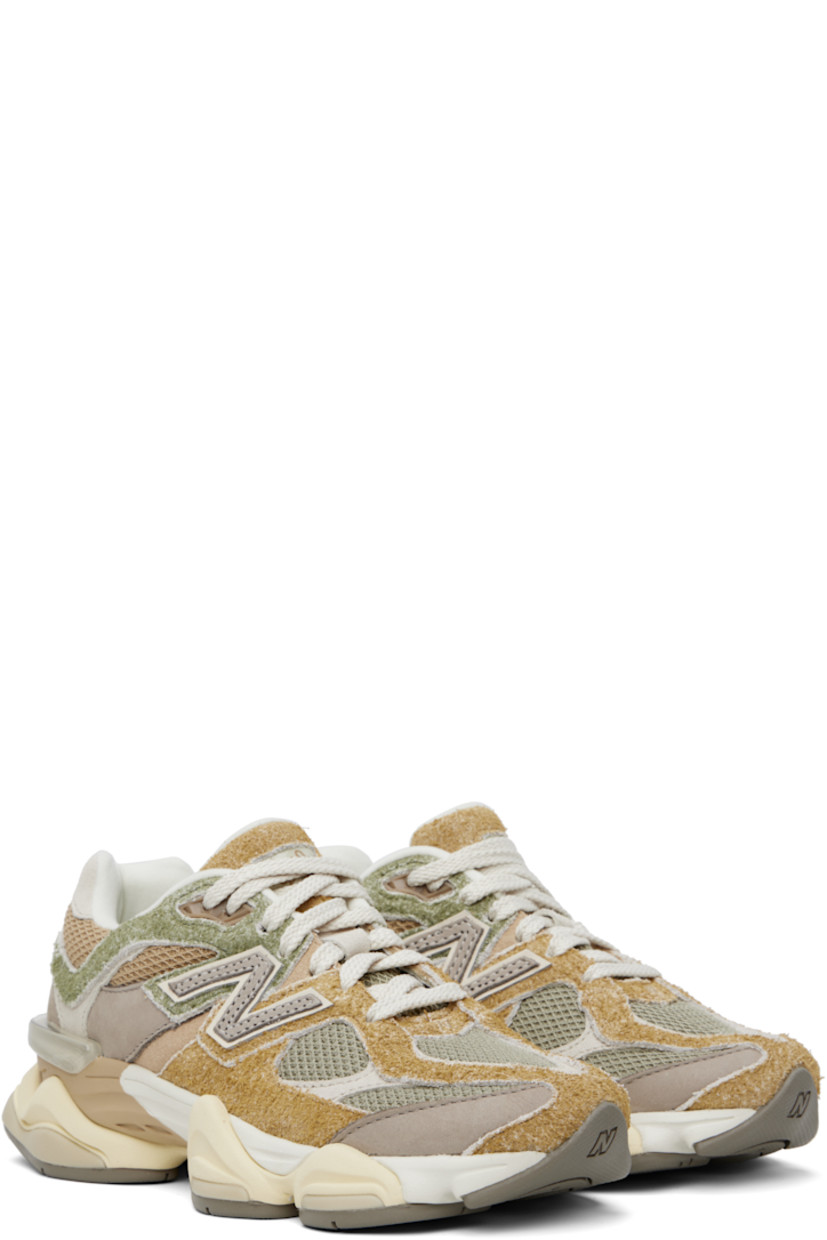 Low-top pigskin suede, buffed pigskin, and mesh sneakers in khaki and gray.

· Logo embroidered at vamp and heel tab
· Lace-up closure
· Rubberized logo patch at padded tongue
· Padded collar
· Logo appliqué at sides
· Jersey lining
· CR stability device at heel
· ABZORB SBS foam rubber midsole
· Treaded rubber sole

Supplier color: Olivine/Great plains/Arid stone