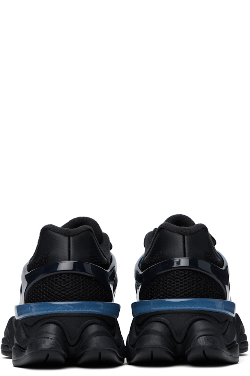 Low-top mesh and rubber sneakers in black and navy.

· Bonded trim throughout
· Lace-up closure
· Inset logo patch at padded tongue
· Padded collar
· Inset logo appliqué at sides
· Fleece lining
· CR stability device at heel
· ABZORB SBS foam rubber midsole
· Treaded rubber sole

Supplier color: Sea stone/Black