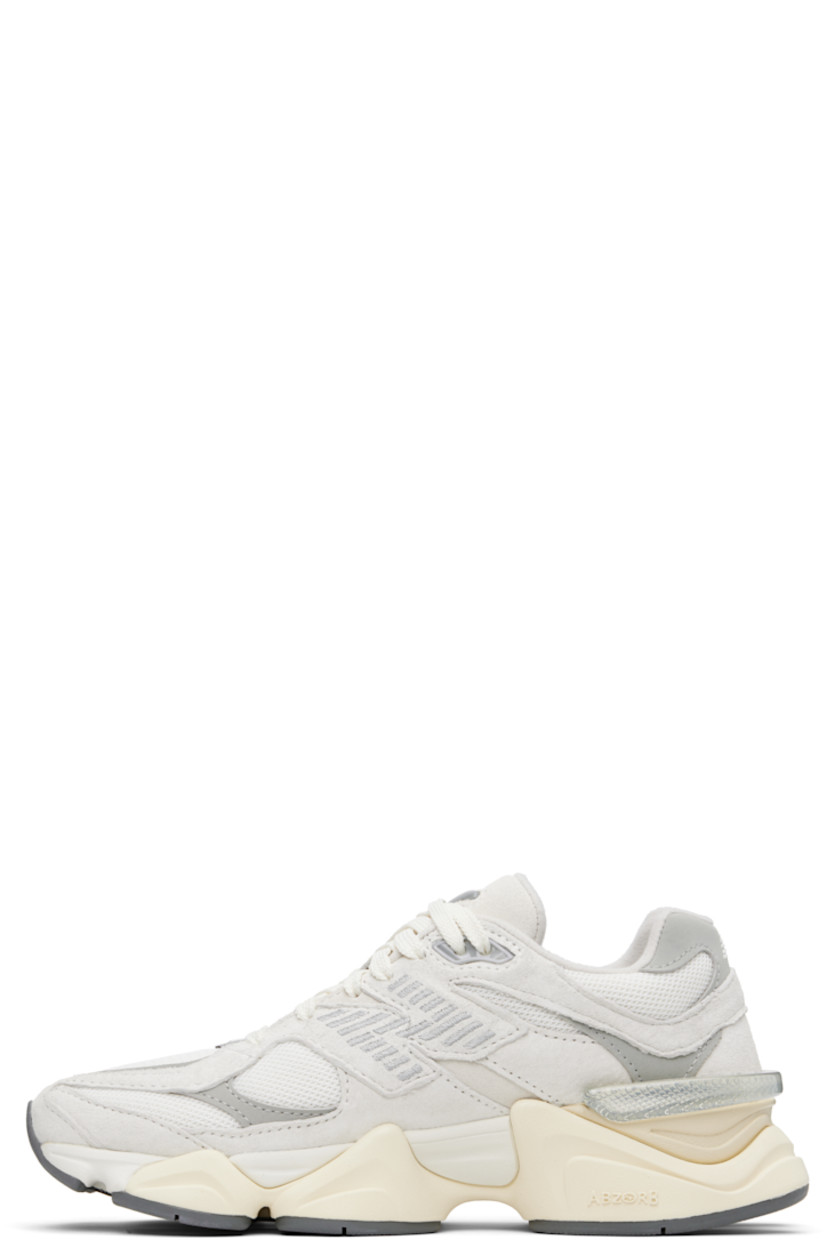 Low-top pigskin suede, buffed pigskin, and mesh sneakers in off-white and gray. Logo embroidered at vamp, inner side, and heel tab.

· Lace-up closure
· Rubberized logo patch at padded tongue
· Padded collar
· Logo appliqué at outer side
· Rubber CR trim at heel counter
· Fleece lining
· ABZORB and SBS dual-density foam rubber midsole
· Treaded rubber sole

Supplier color: Sea salt/Concrete/Silver metallic