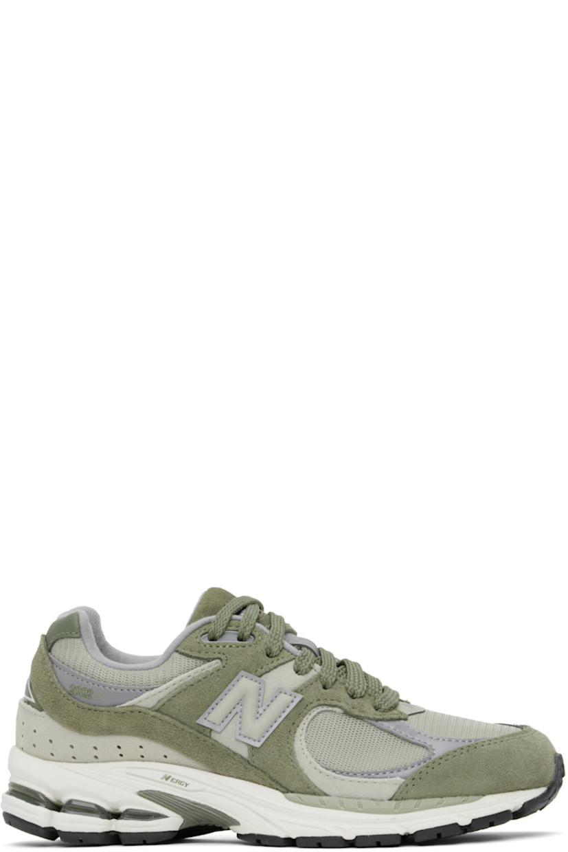 Low-top suede and mesh sneakers in khaki.

· Logo embroidered at vamp
· Lace-up closure
· Inset logo patch at padded tongue
· Padded collar
· Reflective logo appliqué at sides
· Perforated detailing at heel counter
· Jersey lining
· ABZORB® foam rubber midsole
· Treaded N-ergy rubber sole
· Stability Web technology at sole

Supplier color: Dark olivine/Olivine/Slate grey