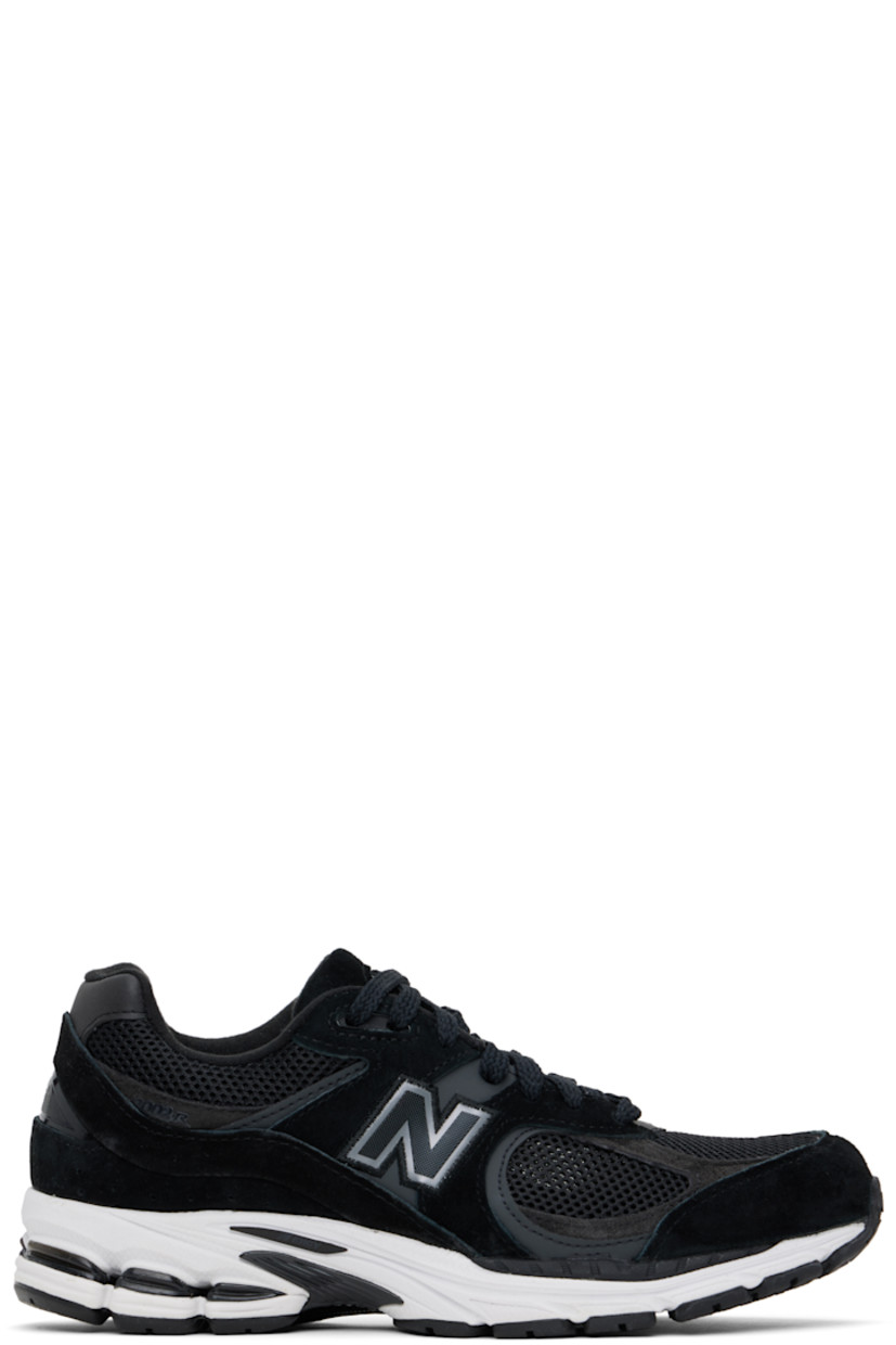 Low-top suede and mesh sneakers in black.

· Logo embroidered at vamp
· Lace-up closure
· Inset logo patch at padded tongue
· Padded collar
· Reflective logo appliqué at sides
· Perforated detailing at heel counter
· Jersey lining
· ABZORB® foam rubber midsole
· Treaded N-ergy rubber sole
· Stability Web technology at sole

Supplier color: Black/Phantom/Gunmetal
