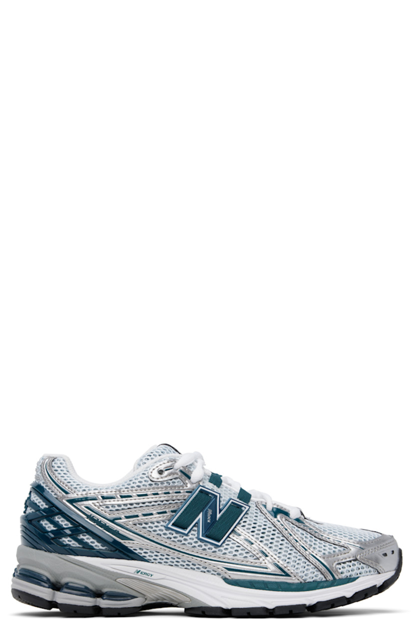 Low-top mesh and grained faux-leather sneakers in green and silver tone.

· Logo embossed at toe 
· Logo printed at vamp
· Lace-up closure
· Logo patch at padded tongue
· Padded collar
· Logo appliqué at sides
· Logo-embossed rubberized heel stabilizer
· ABZORB SBS cushioning at heel
· Mesh lining
· ACTEVA LITE foam rubber midsole
· Treaded N-ergy rubber sole with Stability Web technology

Supplier color: Silver metallic/Deep ocean/White