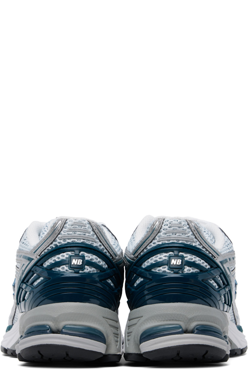 Low-top mesh and grained faux-leather sneakers in green and silver tone.

· Logo embossed at toe 
· Logo printed at vamp
· Lace-up closure
· Logo patch at padded tongue
· Padded collar
· Logo appliqué at sides
· Logo-embossed rubberized heel stabilizer
· ABZORB SBS cushioning at heel
· Mesh lining
· ACTEVA LITE foam rubber midsole
· Treaded N-ergy rubber sole with Stability Web technology

Supplier color: Silver metallic/Deep ocean/White
