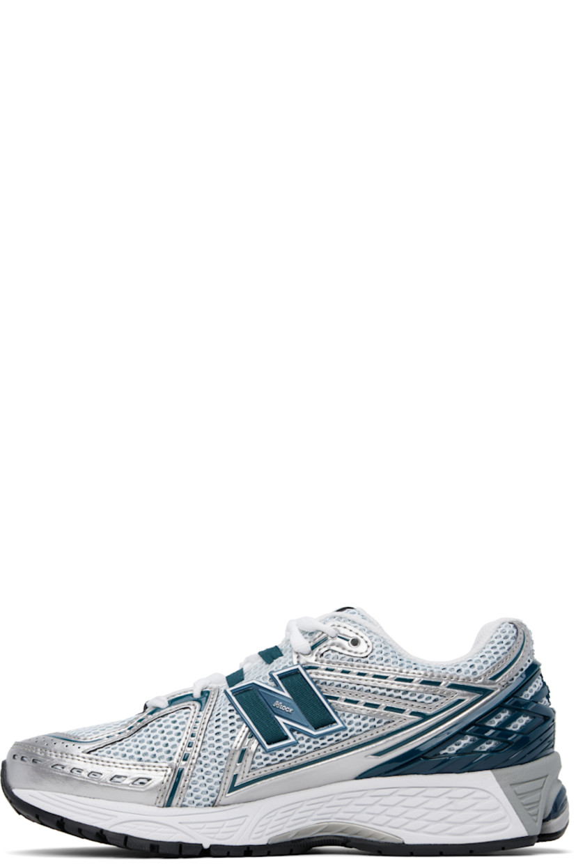 Low-top mesh and grained faux-leather sneakers in green and silver tone.

· Logo embossed at toe 
· Logo printed at vamp
· Lace-up closure
· Logo patch at padded tongue
· Padded collar
· Logo appliqué at sides
· Logo-embossed rubberized heel stabilizer
· ABZORB SBS cushioning at heel
· Mesh lining
· ACTEVA LITE foam rubber midsole
· Treaded N-ergy rubber sole with Stability Web technology

Supplier color: Silver metallic/Deep ocean/White