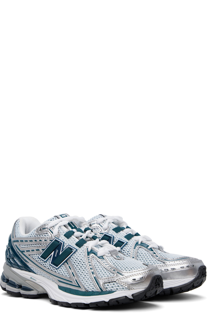 Low-top mesh and grained faux-leather sneakers in green and silver tone.

· Logo embossed at toe 
· Logo printed at vamp
· Lace-up closure
· Logo patch at padded tongue
· Padded collar
· Logo appliqué at sides
· Logo-embossed rubberized heel stabilizer
· ABZORB SBS cushioning at heel
· Mesh lining
· ACTEVA LITE foam rubber midsole
· Treaded N-ergy rubber sole with Stability Web technology

Supplier color: Silver metallic/Deep ocean/White