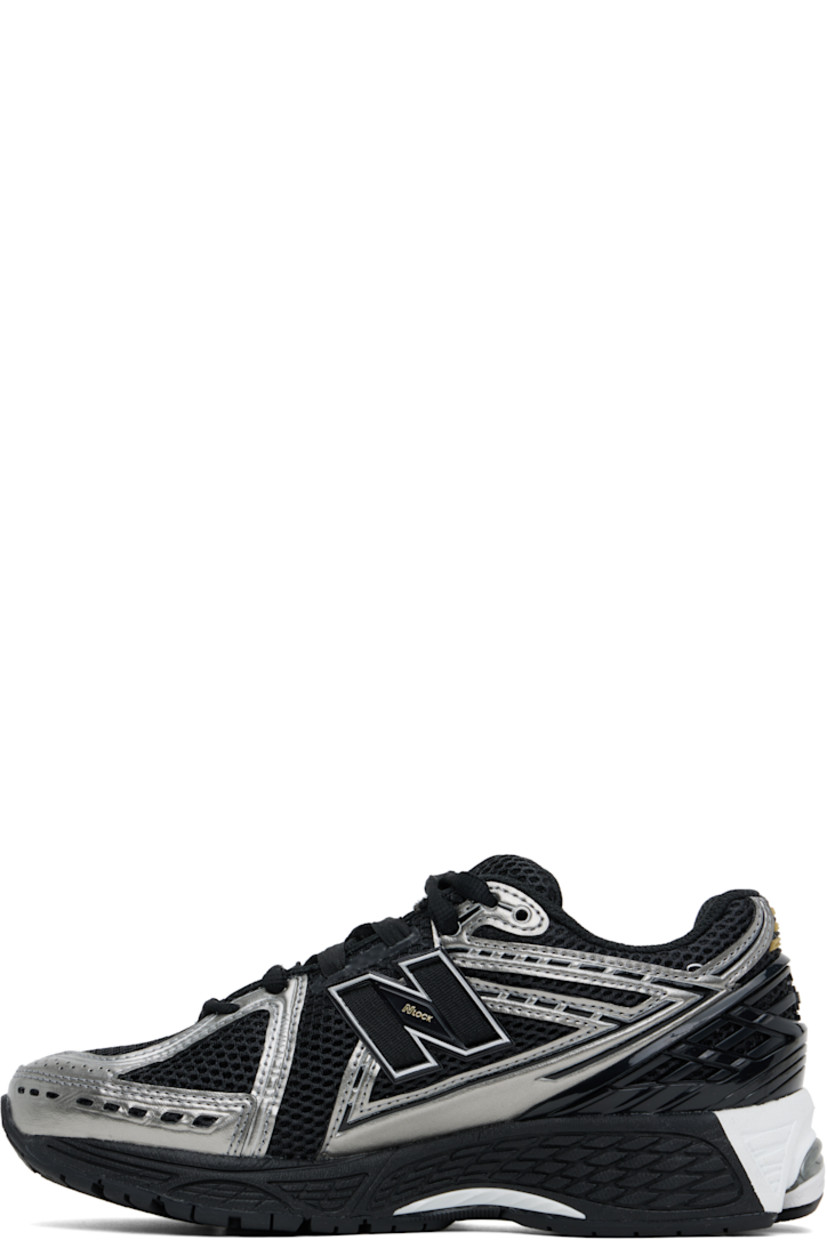 Low-top mesh sneakers in black and silver tone.

· Grained faux-leather trim throughout
· Logo embossed at toe and lace-up closure
· Logo patch at padded tongue
· Padded collar
· Logo appliqué at sides
· Logo-embossed rubberized trim at heel counter
· Mesh lining
· ABZORB SBS foam rubber midsole
· ACTEVA LITE unit at foam midsole
· Treaded N-ergy and Stability Web rubber sole

Supplier color: Black