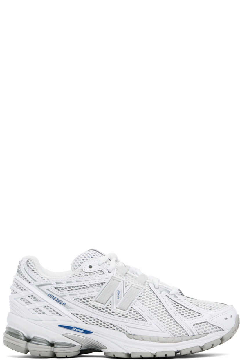 Low-top mesh and faux-leather sneakers in white.

· Lace-up closure
· Logo patch at padded tongue
· Padded collar
· Logo appliqué at sides and heel counter
· Ortholite® footbed
· Mesh lining
· Stability Web arch support
· ABZORB SBS cushioning at heel
· ACTEVA LITE foam rubber midsole
· Treaded N-ergy rubber sole

Supplier color: White/Team royal/Silver metallic