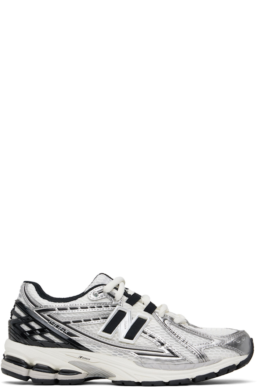 Low-top mesh and grained faux-leather sneakers in white and silver tone.

· Logo printed at vamp
· Lace-up closure
· Logo patch at padded tongue
· Padded collar
· Logo appliqué at sides
· Reflective trim at heel tab
· Logo-embossed rubberized trim at heel counter
· Mesh lining
· ABZORB SBS foam rubber midsole
· ACTEVA LITE unit at foam midsole
· Treaded N-ergy rubber sole
· Stability Web technology at sole

Supplier color: Silver metallic/Black/Sea salt