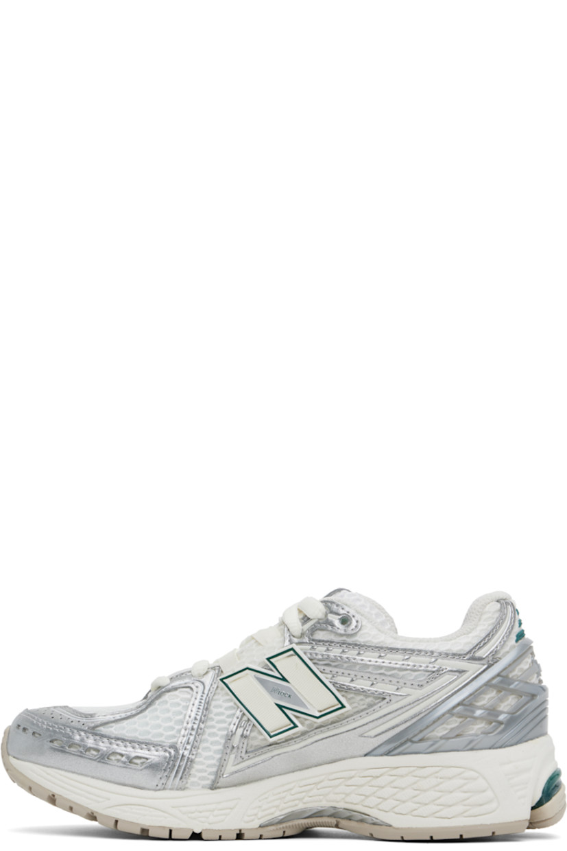 Low-top mesh and grained faux-leather sneakers in white and silver tone.

· Logo embossed at toe and lace-up closure
· Logo patch at padded tongue
· Padded collar
· Logo appliqué at sides
· Reflective trim at heel tab
· Logo-embossed rubber trim at heel counter
· Mesh lining
· ABZORB SBS foam rubber midsole
· ACTEVA LITE unit at foam midsole
· Treaded Stability Web and N-ergy rubber sole

Supplier color: Silver metallic