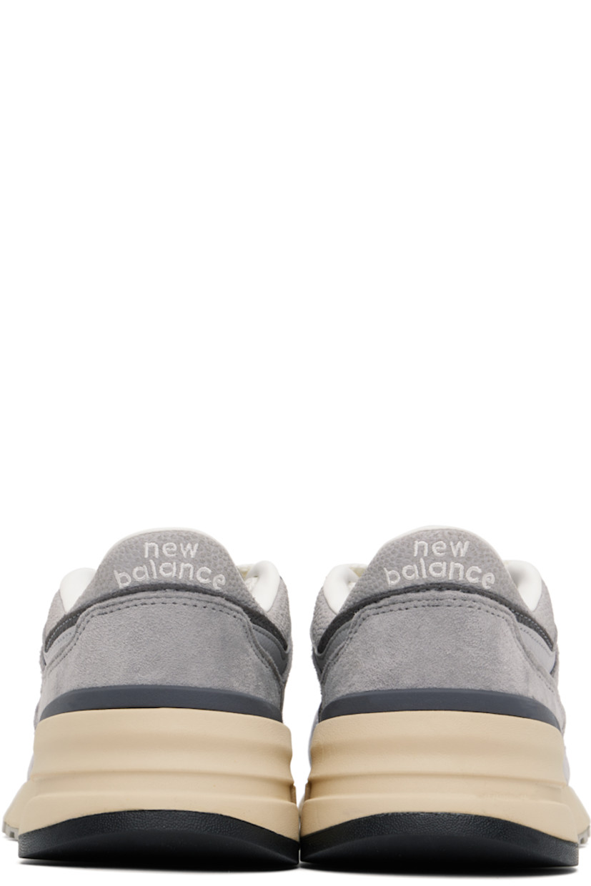 Low-top suede and mesh sneakers in gray.

· Lace-up closure
· Padded tongue and collar
· Logo embroidered at tongue and heel tab
· Logo appliqué at sides
· Buffed leather and mesh lining
· Logo embossed at foam rubber midsole
· Treaded rubber sole

Supplier color: Shadow grey/Rain cloud