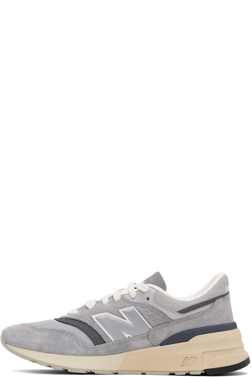 Low-top suede and mesh sneakers in gray.

· Lace-up closure
· Padded tongue and collar
· Logo embroidered at tongue and heel tab
· Logo appliqué at sides
· Buffed leather and mesh lining
· Logo embossed at foam rubber midsole
· Treaded rubber sole

Supplier color: Shadow grey/Rain cloud
