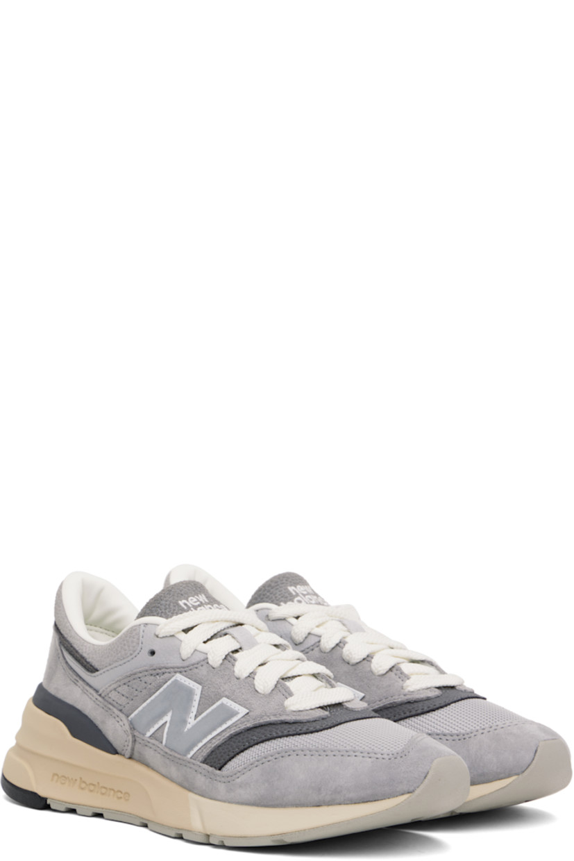 Low-top suede and mesh sneakers in gray.

· Lace-up closure
· Padded tongue and collar
· Logo embroidered at tongue and heel tab
· Logo appliqué at sides
· Buffed leather and mesh lining
· Logo embossed at foam rubber midsole
· Treaded rubber sole

Supplier color: Shadow grey/Rain cloud