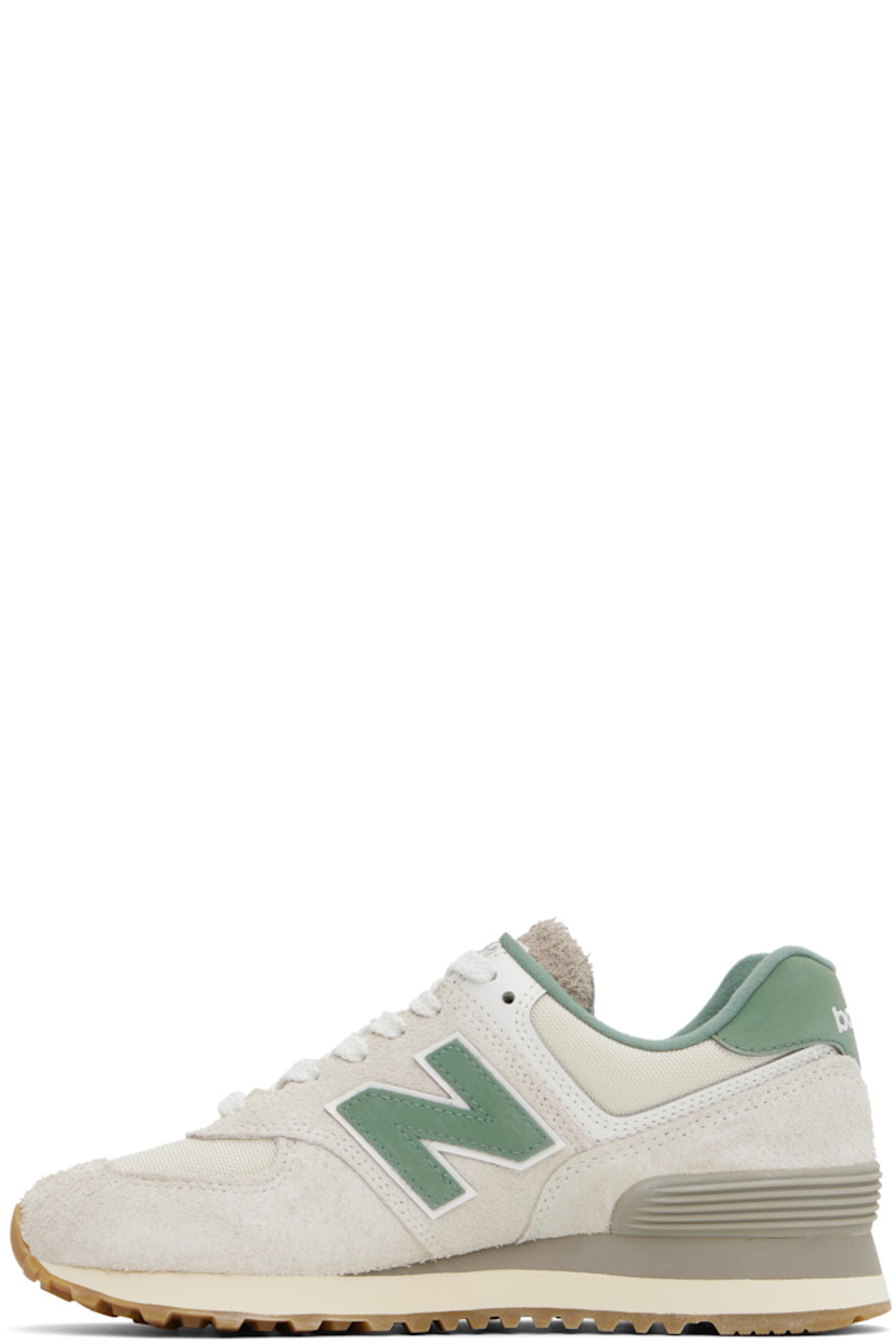Low-top suede and Cordura® canvas sneakers in beige and green. 

· Lace-up closure
· Logo embroidered at tongue and heel tab
· Padded tongue and collar
· Logo appliqué at sides
· Logo-embossed rubberized heel stabilizer 
· Brushed jersey lining
· ENCAP® foam rubber midsole
· Treaded rubber sole

Supplier color: Calcium/New spruce