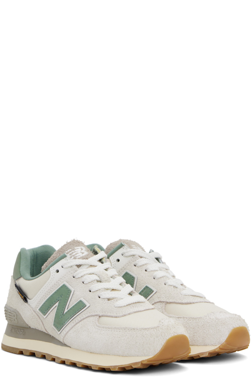 Low-top suede and Cordura® canvas sneakers in beige and green. 

· Lace-up closure
· Logo embroidered at tongue and heel tab
· Padded tongue and collar
· Logo appliqué at sides
· Logo-embossed rubberized heel stabilizer 
· Brushed jersey lining
· ENCAP® foam rubber midsole
· Treaded rubber sole

Supplier color: Calcium/New spruce