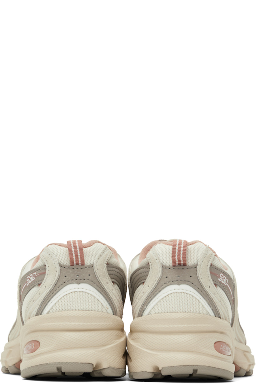 Low-top mesh and suede sneakers in gray and pink.

· Perforations throughout
· Lace-up closure
· Logo stamp at padded tongue
· Padded collar
· Reflective logo appliqué at sides
· Pull-loop at heel collar
· Fleece lining
· Textured ABZORB® rubber midsole
· Treaded rubber sole

Supplier color: Grey/Beige
