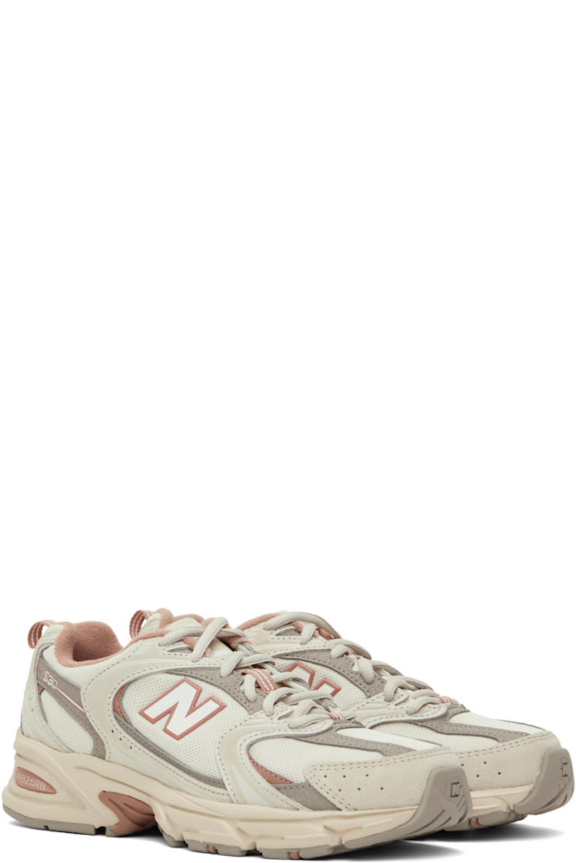 Low-top mesh and suede sneakers in gray and pink.

· Perforations throughout
· Lace-up closure
· Logo stamp at padded tongue
· Padded collar
· Reflective logo appliqué at sides
· Pull-loop at heel collar
· Fleece lining
· Textured ABZORB® rubber midsole
· Treaded rubber sole

Supplier color: Grey/Beige