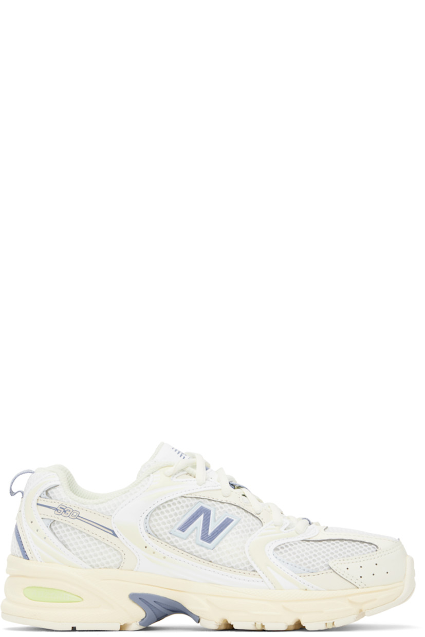 Low-top semi-sheer mesh and grained faux-leather sneakers in off-white and blue.

· Perforations throughout
· Lace-up closure
· Logo printed at padded tongue
· Padded collar
· Rubberized logo appliqué at sides
· Text embossed at outer side
· Pull-loop at heel tab
· Mesh lining
· ABZORB foam rubber midsole
· Treaded rubber sole

Supplier color: Angora/Dusk shower/Ice blue