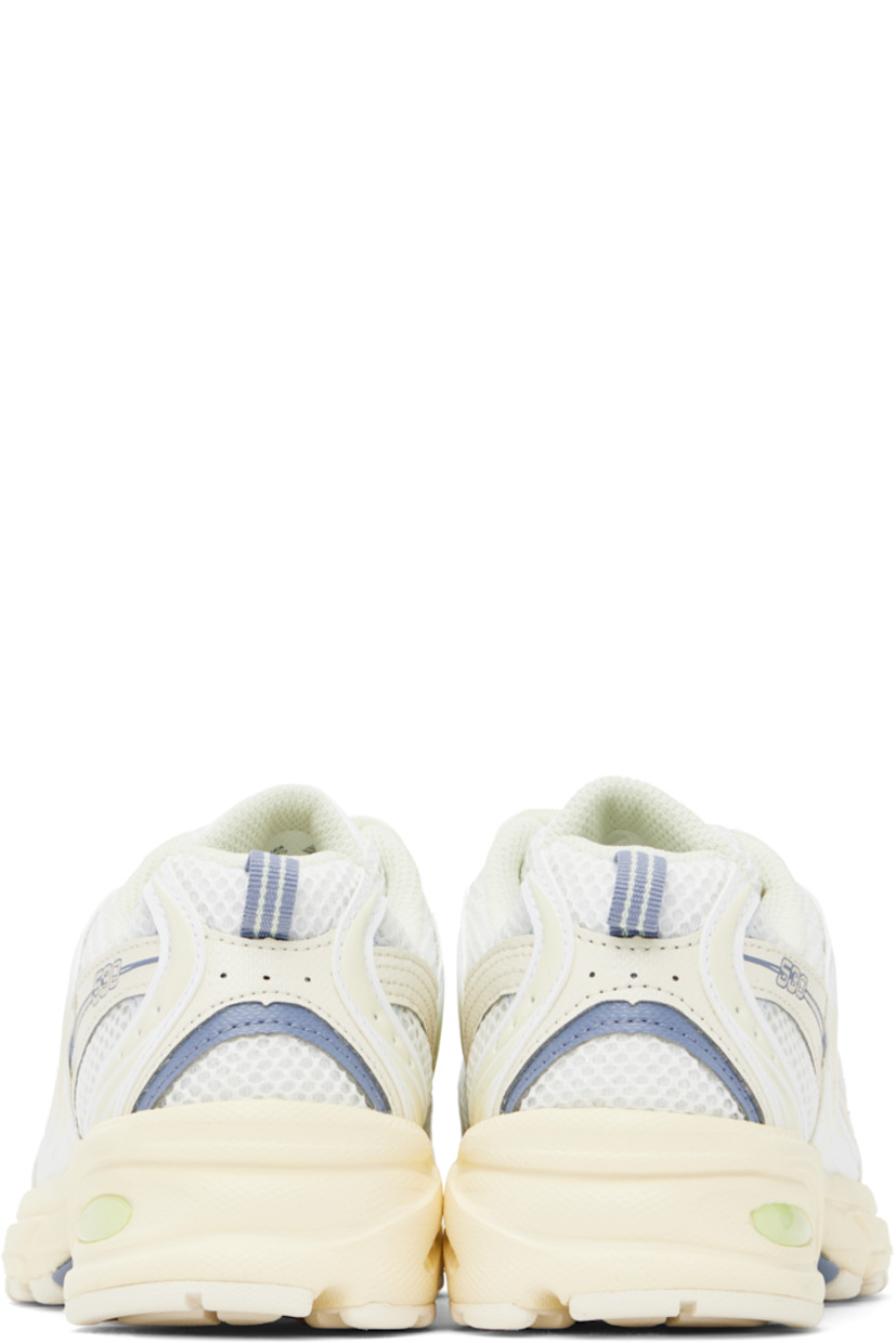 Low-top semi-sheer mesh and grained faux-leather sneakers in off-white and blue.

· Perforations throughout
· Lace-up closure
· Logo printed at padded tongue
· Padded collar
· Rubberized logo appliqué at sides
· Text embossed at outer side
· Pull-loop at heel tab
· Mesh lining
· ABZORB foam rubber midsole
· Treaded rubber sole

Supplier color: Angora/Dusk shower/Ice blue